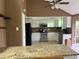 Cozy kitchen with white cabinetry, granite countertops, and stainless steel appliances at 9155 Pemberton St, Spring Hill, FL 34608