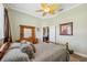 Bedroom featuring plush blankets, hardwood floors, and natural light at 9431 Amidon St, Spring Hill, FL 34608