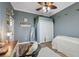 Comfortable bedroom featuring wood-look floors and a stylish full-length mirror at 9431 Amidon St, Spring Hill, FL 34608