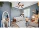 Relaxing bedroom with a large window, desk, and wood-look floors at 9431 Amidon St, Spring Hill, FL 34608