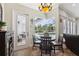 Breakfast nook with hardwood floors, overhead light and view of the pool and backyard at 9431 Amidon St, Spring Hill, FL 34608