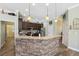 Spacious kitchen with stone countertop, hardwood floors, and stainless steel appliances at 9431 Amidon St, Spring Hill, FL 34608