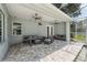 Relaxing covered patio area with comfortable seating and ceiling fans at 9431 Amidon St, Spring Hill, FL 34608