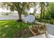 Spacious backyard featuring a shed, established tree, and privacy fence at 9630 Eldridge Rd, Spring Hill, FL 34608