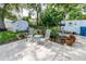 Landscaped backyard featuring an outdoor seating area and a shed for extra storage at 9630 Eldridge Rd, Spring Hill, FL 34608