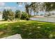 Expansive backyard with lush lawn and privacy fence; perfect for outdoor activities and relaxation at 9630 Eldridge Rd, Spring Hill, FL 34608