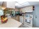 Efficient kitchen with modern appliances and a skylight, offering a functional layout at 9630 Eldridge Rd, Spring Hill, FL 34608