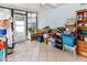 Enclosed lanai space with tile flooring, ceiling fan, and access to the backyard at 9630 Eldridge Rd, Spring Hill, FL 34608
