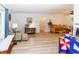 Bright living area with wood floors, comfortable seating, and windows that let in natural light at 9630 Eldridge Rd, Spring Hill, FL 34608