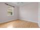 Empty bedroom with hardwood floors and window at 1010 Teal Pointe, Tarpon Springs, FL 34689