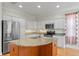 Updated kitchen features stainless appliances, granite countertops and a center island at 1010 Teal Pointe, Tarpon Springs, FL 34689