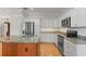 Bright kitchen features stainless steel appliances, light countertops and white cabinetry at 1010 Teal Pointe, Tarpon Springs, FL 34689