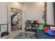 View from a bedroom, looking out to a hallway and the home's modern staircase at 10342 Altrara Way, Trinity, FL 34655