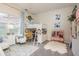 Charming bedroom design featuring an elevated bed, vanity and decor at 10342 Altrara Way, Trinity, FL 34655