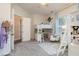 Cozy bedroom with blue accents, a comfortable chair and charming decorations at 10342 Altrara Way, Trinity, FL 34655