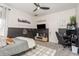 Modern bedroom with gray accents, a ceiling fan and dedicated gaming area at 10342 Altrara Way, Trinity, FL 34655