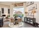Cozy dining area with a large window, custom shelving, and a view of the outdoor gazebo at 10342 Altrara Way, Trinity, FL 34655