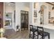 Hallway with a wine storage unit, marble countertop, and an open view to a bedroom at 10342 Altrara Way, Trinity, FL 34655
