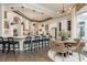 Bright, open kitchen with a large island, bar seating, and an adjacent breakfast area at 10342 Altrara Way, Trinity, FL 34655