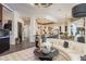 Open-concept living room with a comfortable sofa and views into the kitchen and dining area at 10342 Altrara Way, Trinity, FL 34655