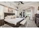 The main bedroom offers a spacious layout, neutral tones, and a cozy seating area with scenic views at 10342 Altrara Way, Trinity, FL 34655