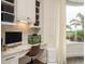 Features a built-in desk, storage, and a window providing natural light and views of the landscape at 10342 Altrara Way, Trinity, FL 34655