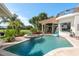 Beautiful backyard pool and spa area with lush landscaping and golf course view at 10342 Altrara Way, Trinity, FL 34655