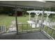 View from screened-in back porch featuring seating, pergola, and storage shed at 1042 Howell Ave, Brooksville, FL 34601