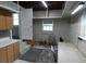 Basement with a small kitchenette, table, chairs, and access to another room at 1042 Howell Ave, Brooksville, FL 34601