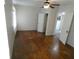 Spacious bedroom with hardwood floors, ceiling fan, and ample closet space at 1042 Howell Ave, Brooksville, FL 34601