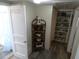 Hallway featuring built-in shelving and access to the shower at 1042 Howell Ave, Brooksville, FL 34601