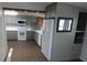 Charming kitchen with gray cabinets, white appliances, and modern countertops at 1042 Howell Ave, Brooksville, FL 34601