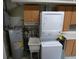 Laundry space featuring a stacked washer and dryer with utility sink at 1042 Howell Ave, Brooksville, FL 34601
