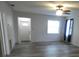 Bright room with neutral walls, light-colored wood floors, and lots of natural light at 1042 Howell Ave, Brooksville, FL 34601