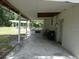 Covered patio providing shade and outdoor living space at 1042 Howell Ave, Brooksville, FL 34601