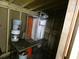 Unfinished shed interior with supplies ready for customization and storage at 1042 Howell Ave, Brooksville, FL 34601