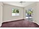 Bright bedroom featuring a ceiling fan and sliding glass doors to the outdoor space at 10935 New Brighton Ct, New Port Richey, FL 34654