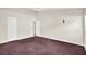 A minimalistic bedroom with vaulted ceilings, carpeted floor and a closet at 10935 New Brighton Ct, New Port Richey, FL 34654