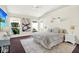 Cozy bedroom featuring neutral decor, a comfortable bed, and lots of natural light at 10935 New Brighton Ct, New Port Richey, FL 34654