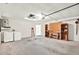 Functional garage space with laundry area, workbench, and storage shelves at 10935 New Brighton Ct, New Port Richey, FL 34654