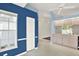 Bright eat-in kitchen shows blue accent wall and easy access to the main living space at 10935 New Brighton Ct, New Port Richey, FL 34654