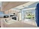 Bright eat-in kitchen features wood cabinets, modern appliances, and a large window at 10935 New Brighton Ct, New Port Richey, FL 34654