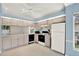 Bright kitchen with wood cabinets, modern appliances, and ample counter space for cooking at 10935 New Brighton Ct, New Port Richey, FL 34654