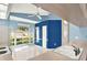 Eat-in kitchen features large window, modern appliances and a stylish blue accent wall at 10935 New Brighton Ct, New Port Richey, FL 34654