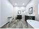 An open bathroom area with double sinks, soaking tub, and walk-in shower at 10941 Hilltop Dr, New Port Richey, FL 34654