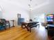 Well-lit game room boasting hardwood floors and outdoor access with views at 10941 Hilltop Dr, New Port Richey, FL 34654