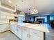 Open-concept kitchen featuring island seating and ample countertop space, perfect for entertaining at 10941 Hilltop Dr, New Port Richey, FL 34654