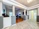 Open concept living room with hardwood floors and stylish architectural beams and columns at 10941 Hilltop Dr, New Port Richey, FL 34654