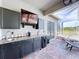 Outdoor kitchen complete with granite countertops, sink and beverage cooler at 10941 Hilltop Dr, New Port Richey, FL 34654