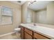 Bright bathroom featuring a modern sink and toilet at 1104 Ketzal Dr, Trinity, FL 34655